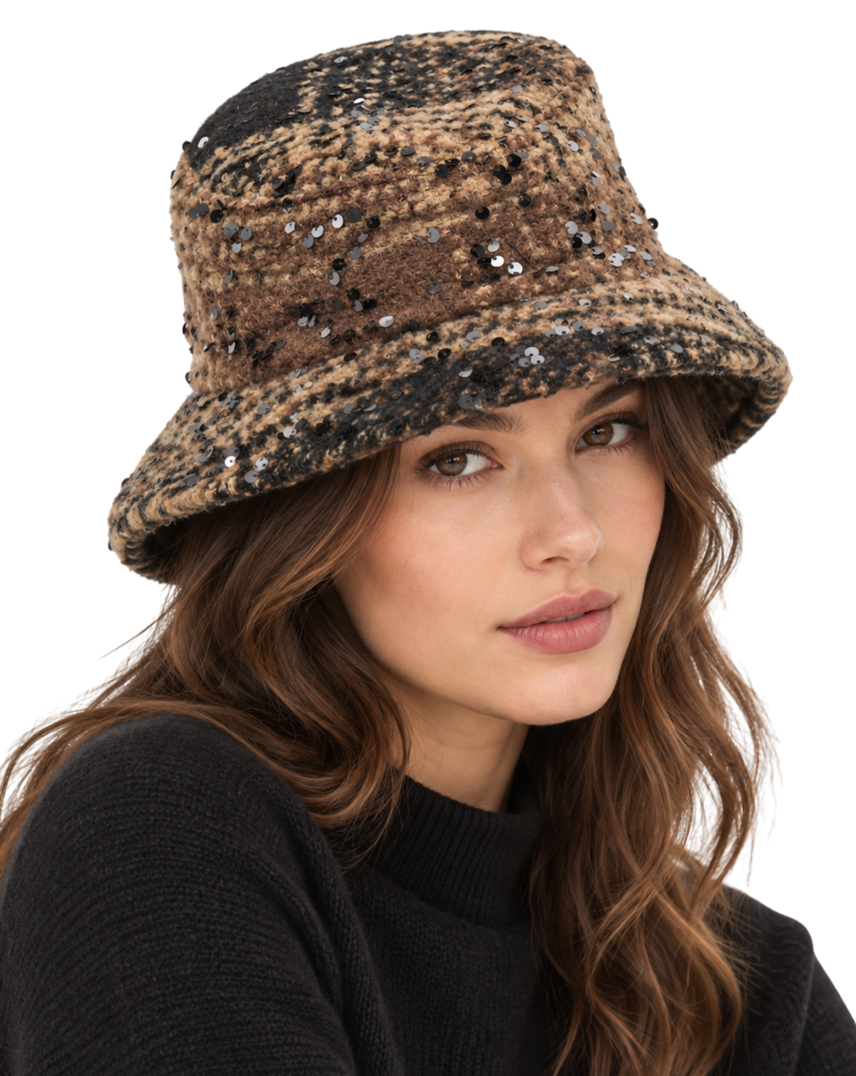 A woman wearing a brown and black patterned bucket hat embellished with sequins, paired with a black knit sweater, against a plain white background.