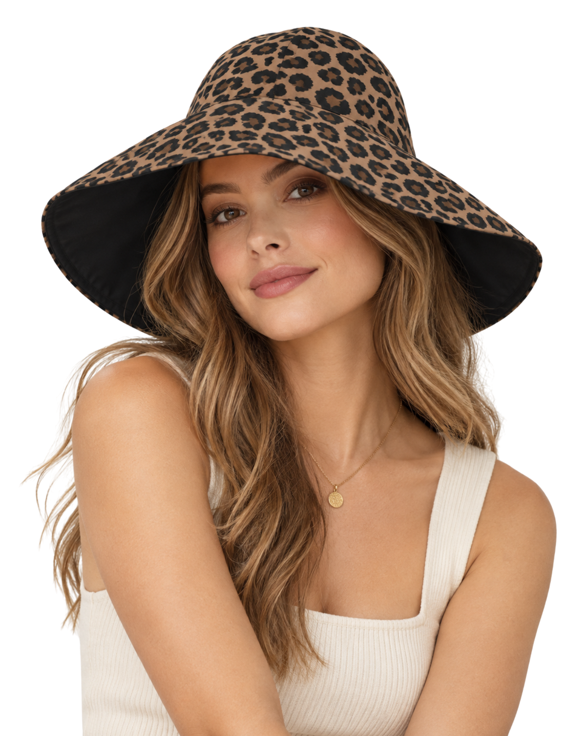 A woman wearing a leopard print wide-brim sun hat with a black interior, paired with a cream ribbed tank top and a small gold pendant necklace, set against a plain white background.