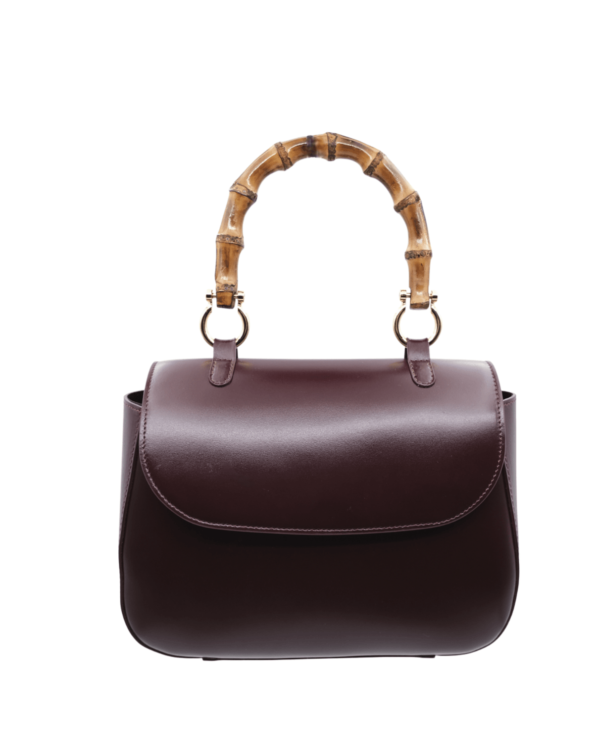 A structured dark burgundy leather handbag with a bamboo handle and gold-tone hardware, shown against a plain white background.