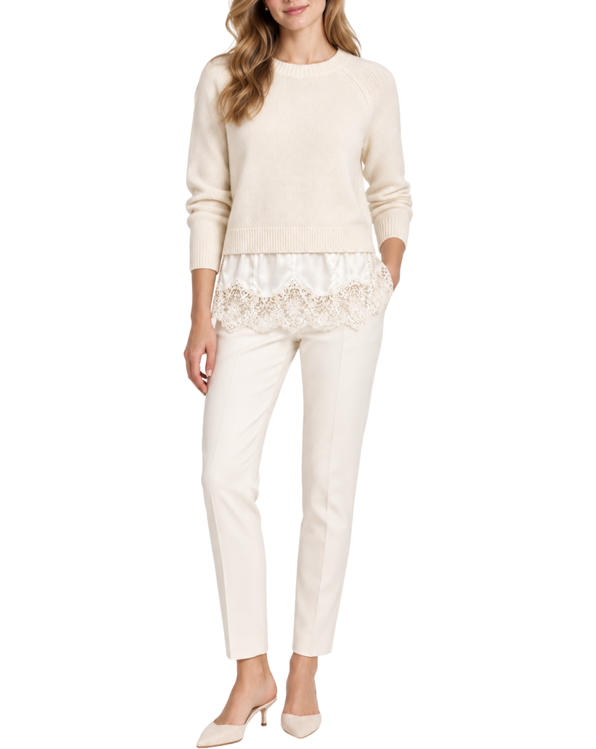A woman modeling a cream-colored knit sweater and matching slim-fit trousers with a lace detail at the hem, paired with pointed-toe heels against a plain white background.