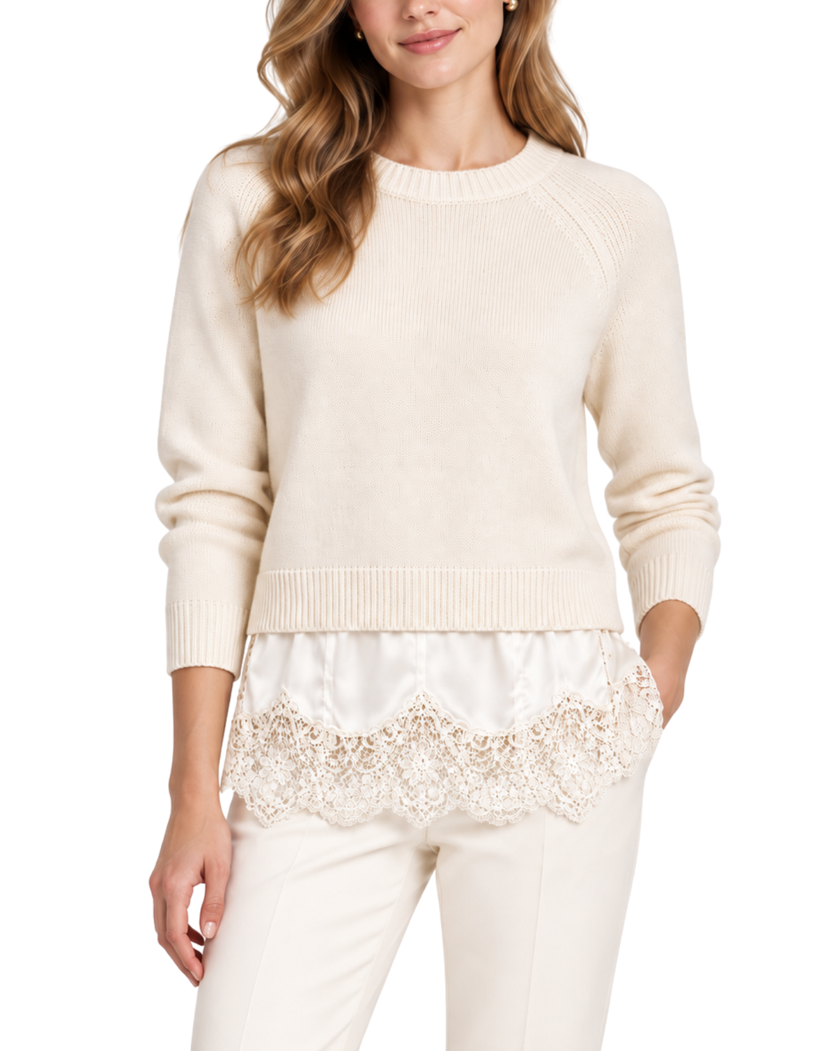 A woman wearing a cream-colored knit sweater with a decorative lace hem overlay, paired with matching cream pants, against a plain white background.