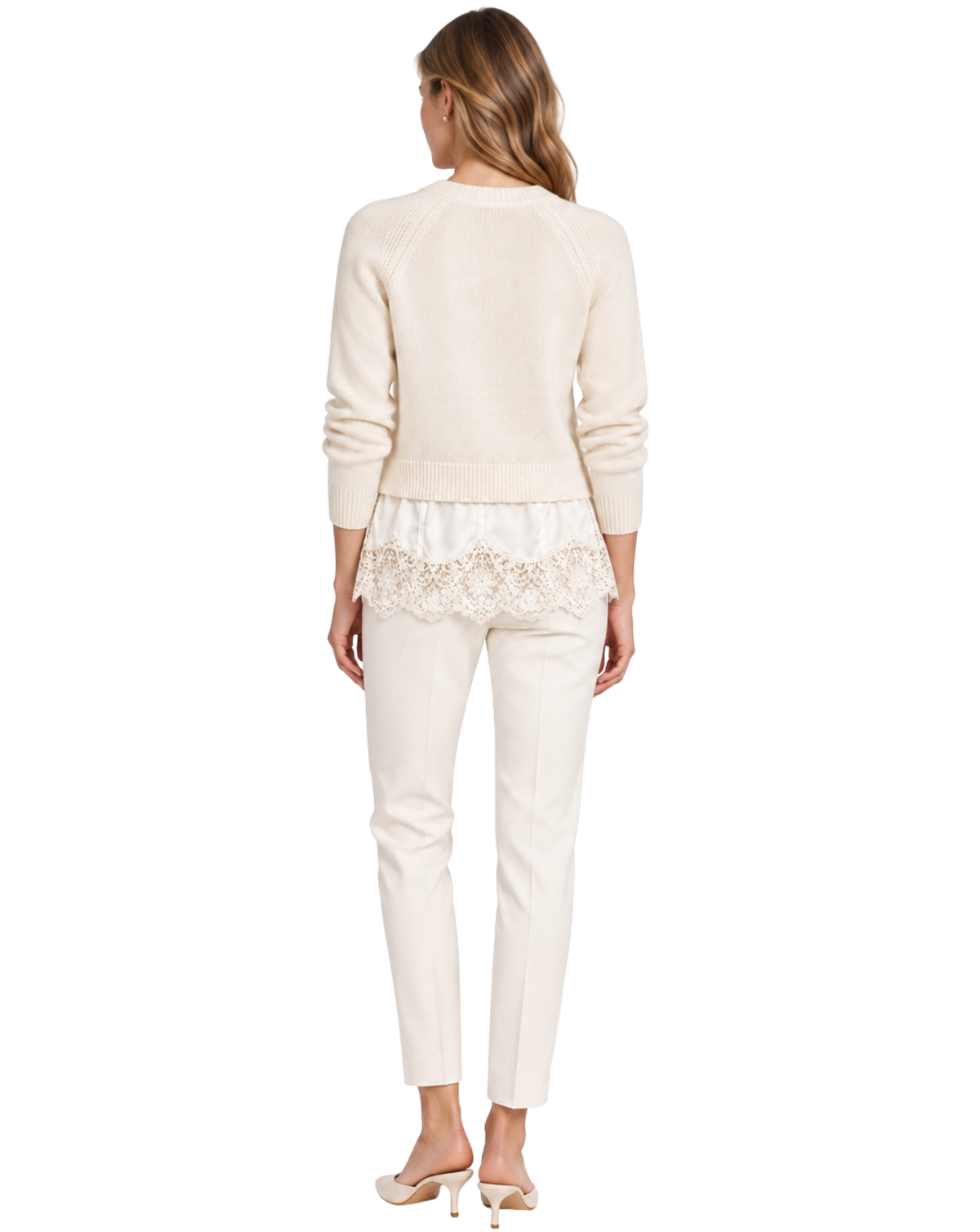 A woman shown from the back wearing a cream-colored knit sweater with a lace hem detail, matching cream pants, and nude high heels against a plain white background.