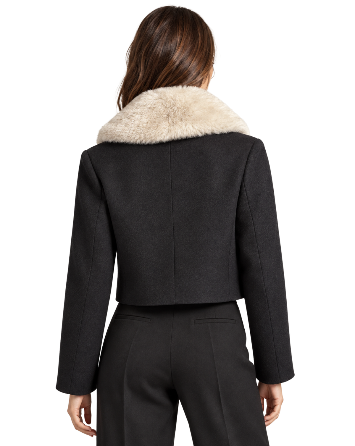 A woman shown from the back wearing a cropped black jacket with a large cream faux-fur collar, paired with black trousers, against a plain white background.