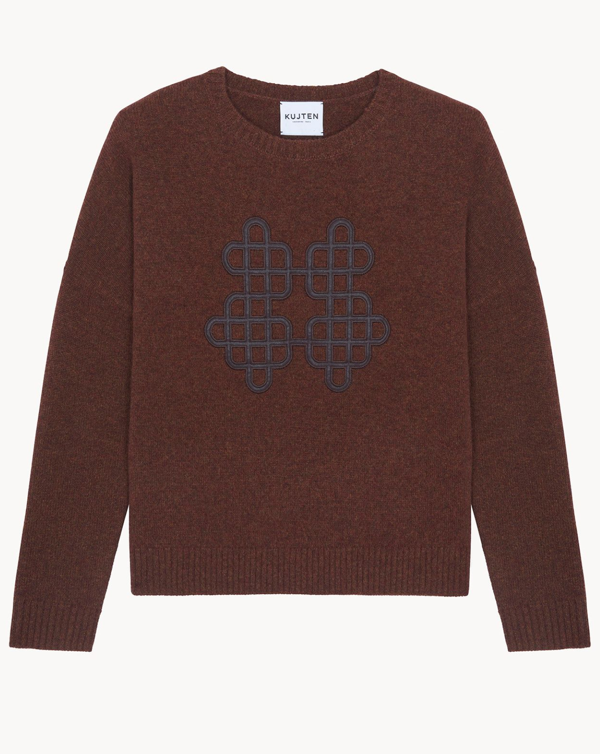 A brown knit crewneck sweater with a dark blue geometric patterned motif on the chest, displayed flat against a light off-white background. The brand label 'KULTEN' is visible at the inner collar.