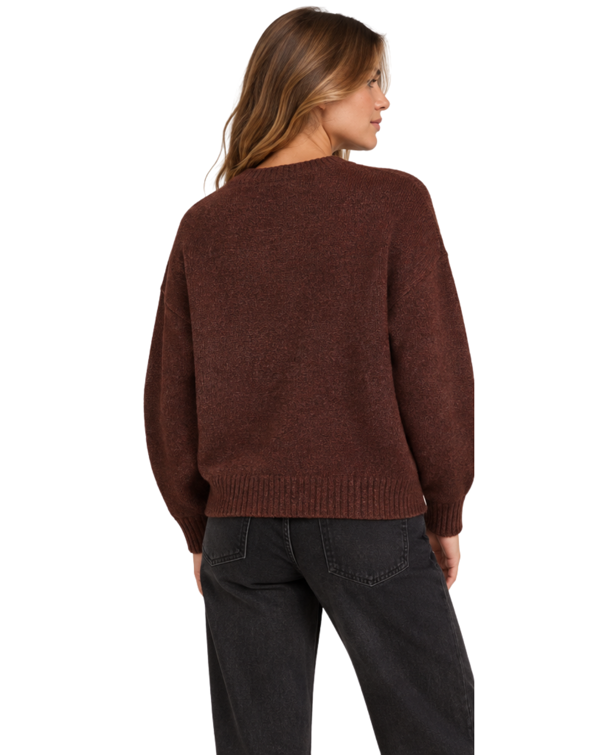 A woman shown from the back wearing a dark brown knit sweater and black jeans against a plain white background.