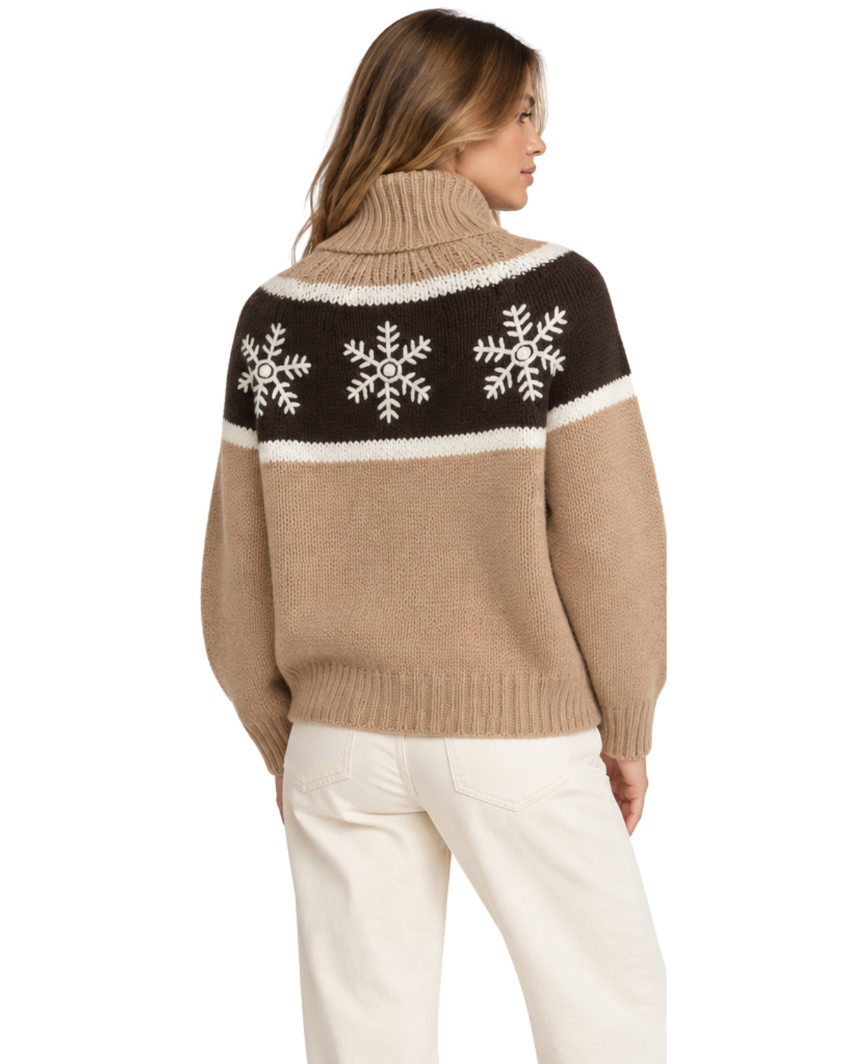 A woman shown from the back wearing a knit turtleneck sweater with a brown yoke featuring three white snowflakes, a cream horizontal stripe, and a tan body with cream knit sleeves and hem, paired with cream pants on a white background.