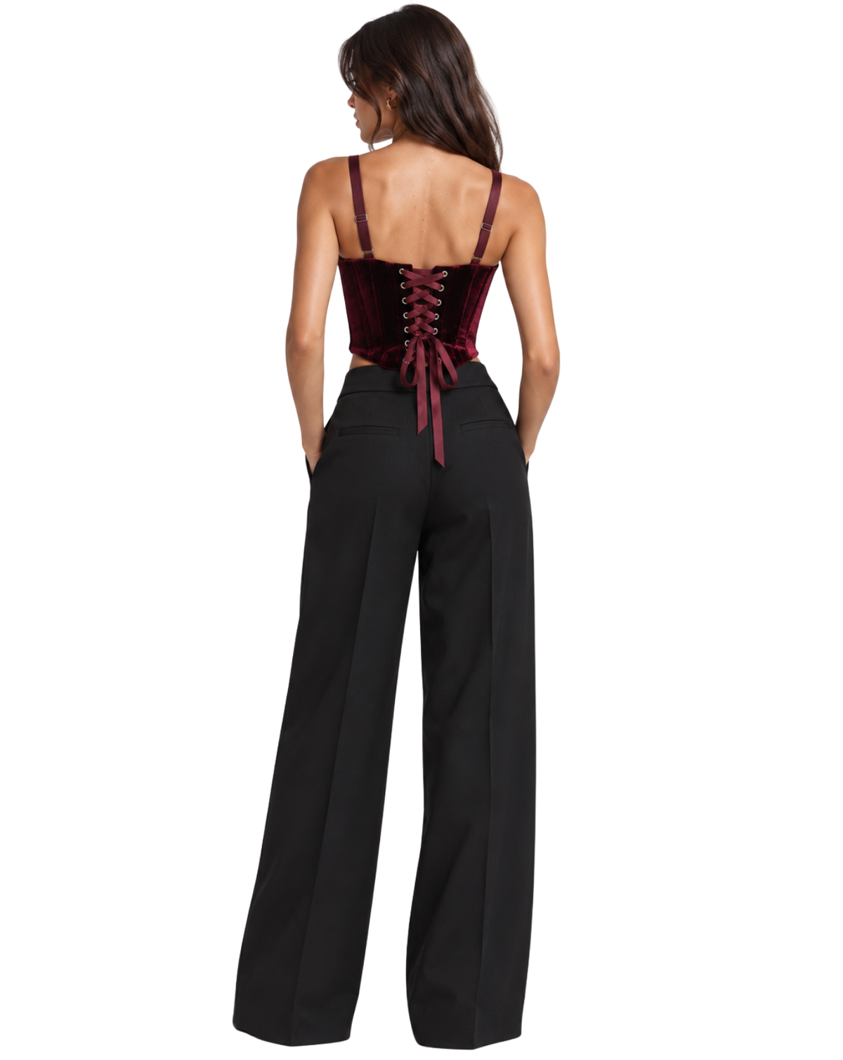 A woman shown from the back wearing a sleeveless dark red velvet corset-style top with thin straps and a lace-up back, paired with black wide-leg pants, against a plain white background.