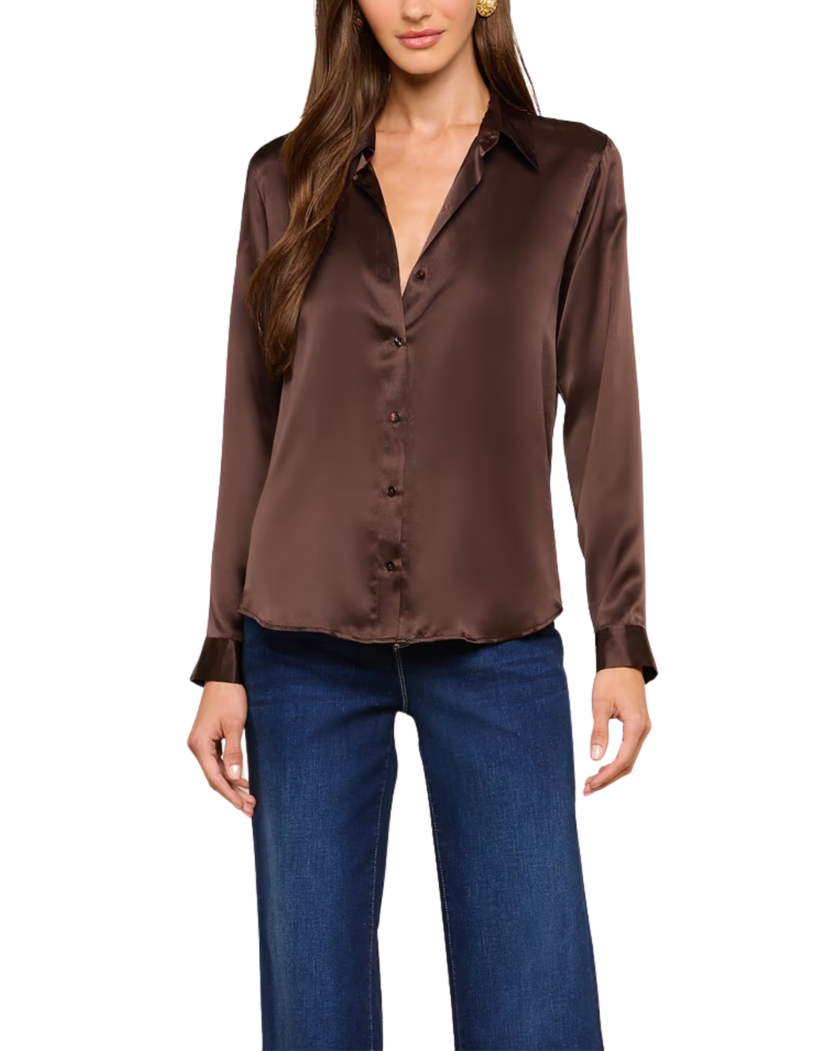 A woman wearing a long-sleeve satin button-up blouse in dark brown with blue jeans, shown from the waist up against a plain white background.