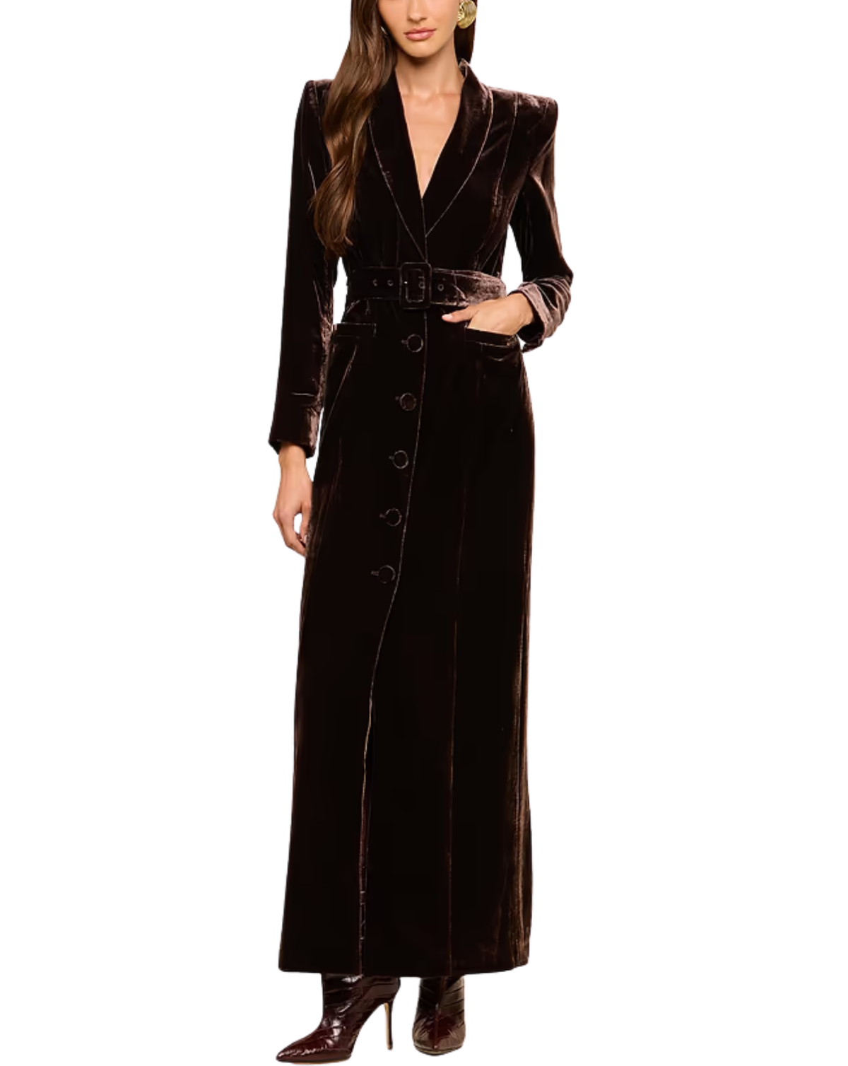 A woman models a long, dark brown velvet wrap coat with a matching belt and button-front detail, paired with dark brown pointed-toe heels, against a plain white background.