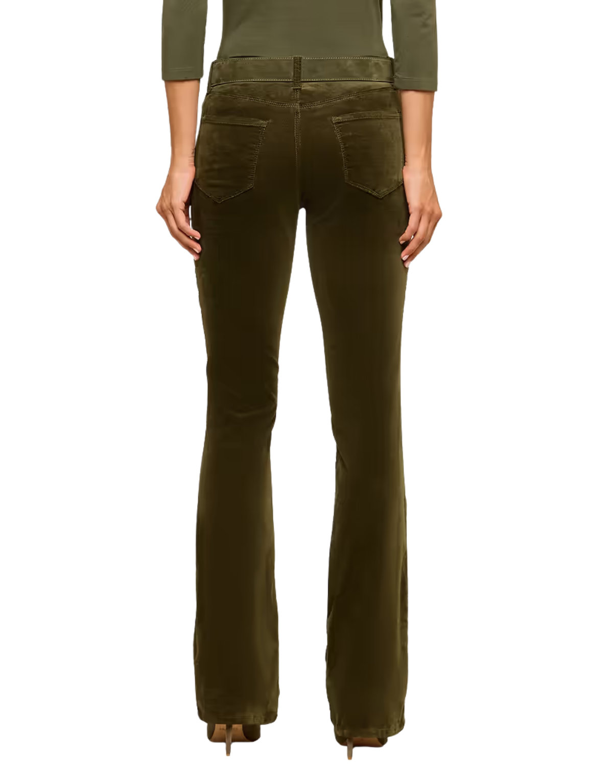Rear view of a model wearing olive green corduroy flare jeans with a matching olive green long-sleeve top, set against a plain white background.