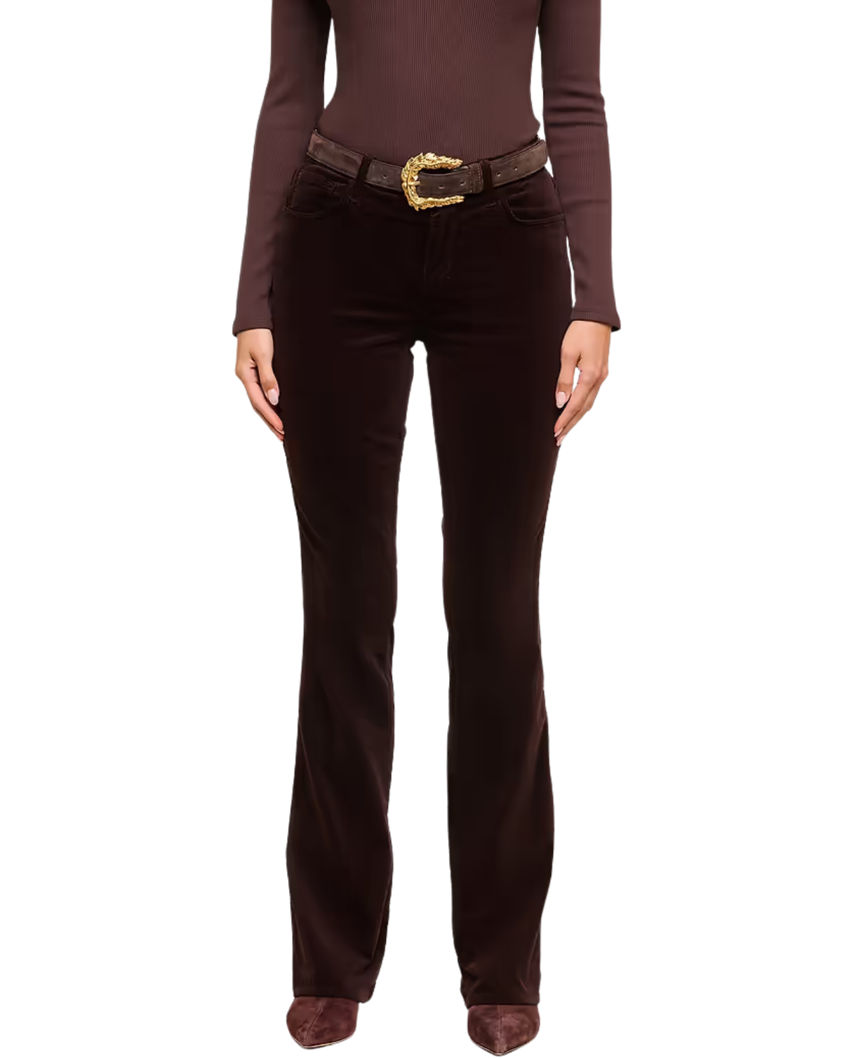 A model wearing dark brown velvet flare pants with a matching dark brown belt featuring a gold buckle, paired with a brown long-sleeve top and brown pointed-toe heels, set against a plain white background.