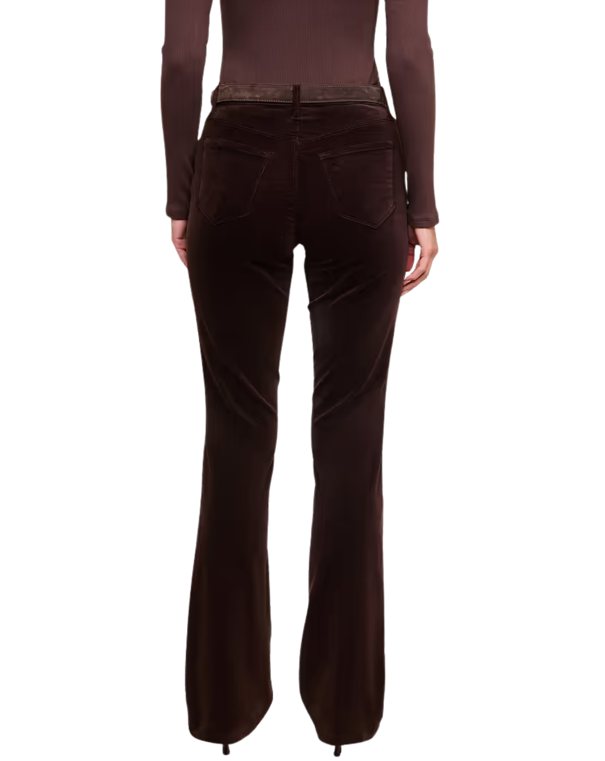 Rear view of a model wearing dark brown velvet flare jeans and a matching long-sleeve top against a plain white background.
