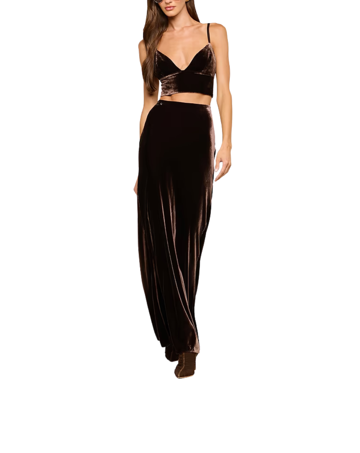 A model wearing a two-piece dark brown velvet outfit consisting of a spaghetti-strap crop top and matching wide-leg pants, shown against a plain white background.