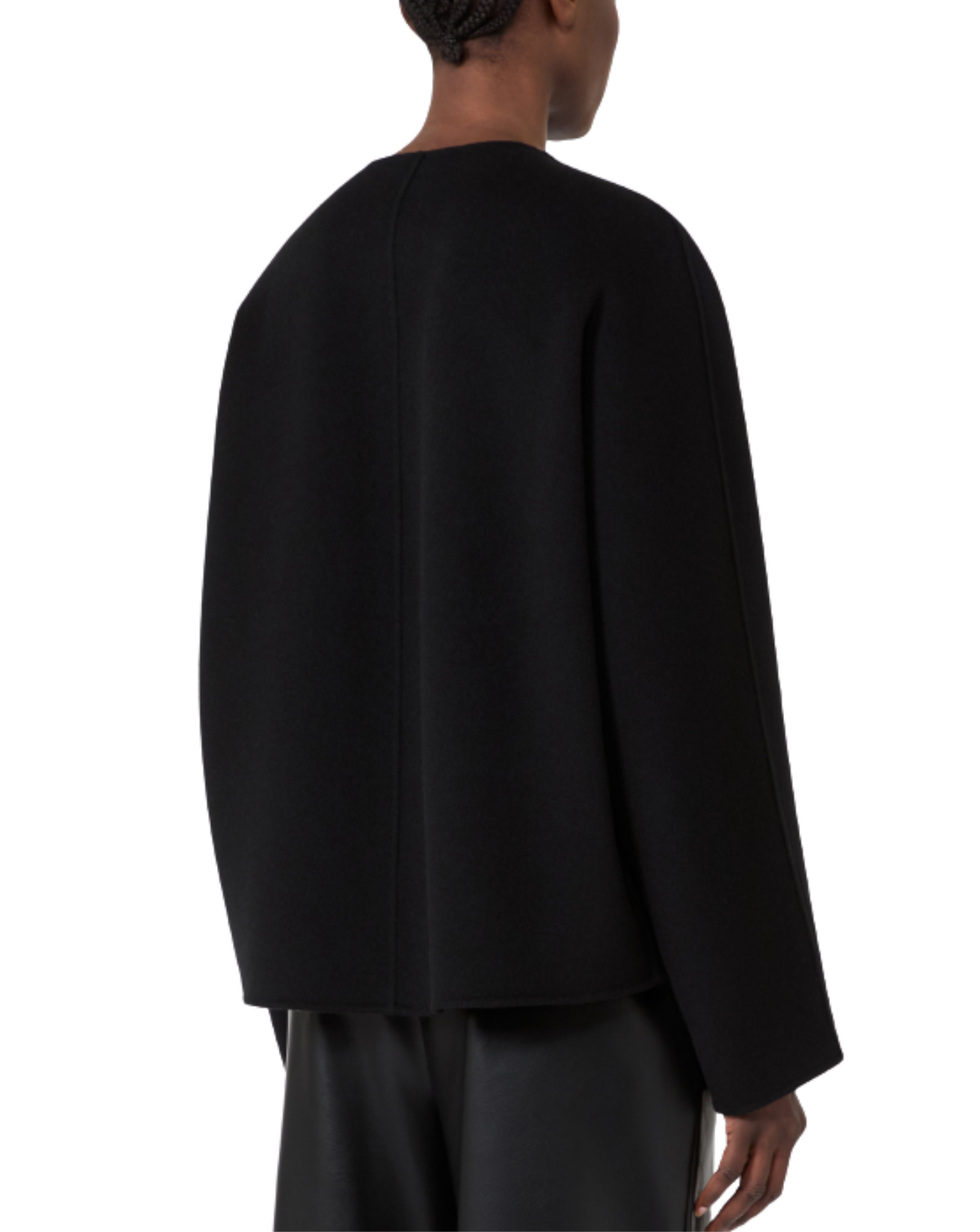 A model shown from the back wearing a black long-sleeve cropped jacket and black trousers against a plain white background.