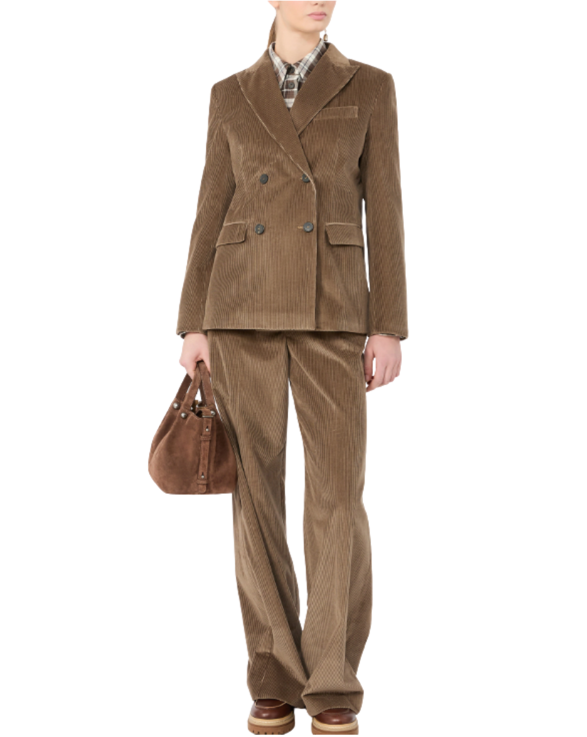A model wearing a brown corduroy double-breasted blazer and matching trousers, styled with a plaid shirt, brown loafers, and a brown leather handbag against a plain white background.