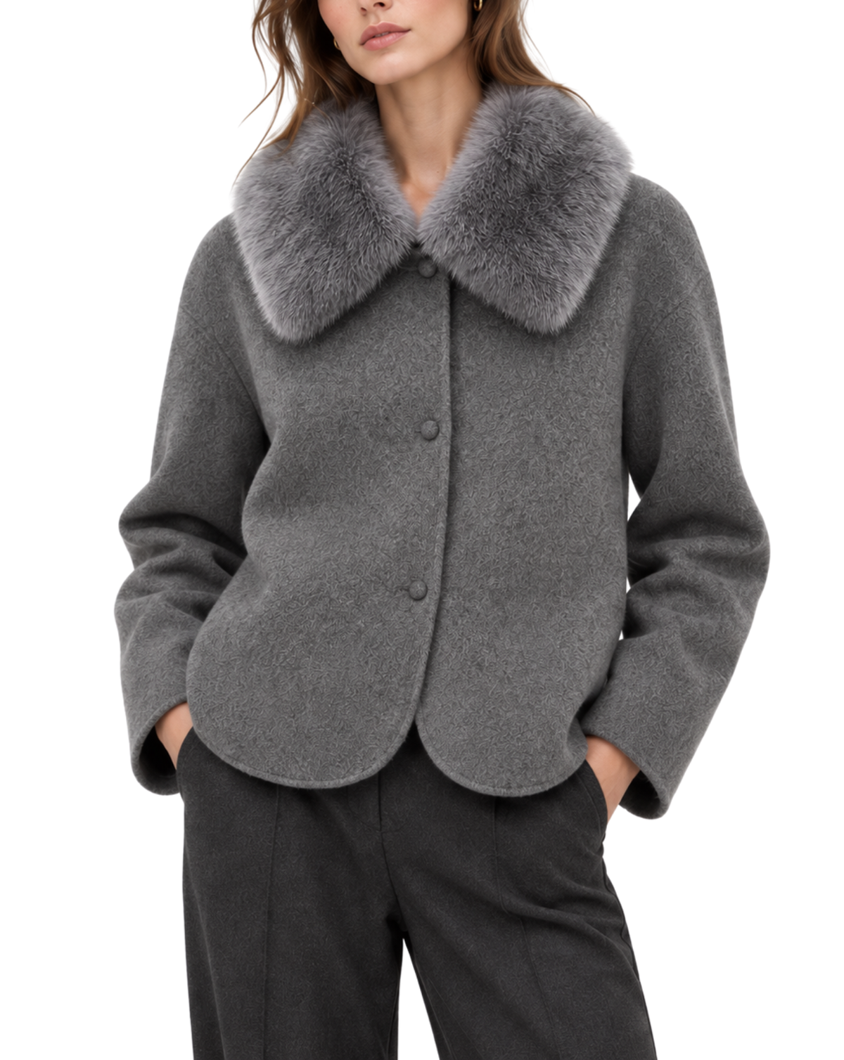 A woman wearing a gray wool-blend jacket with a large fluffy gray faux-fur collar, paired with dark charcoal trousers, against a plain white background.