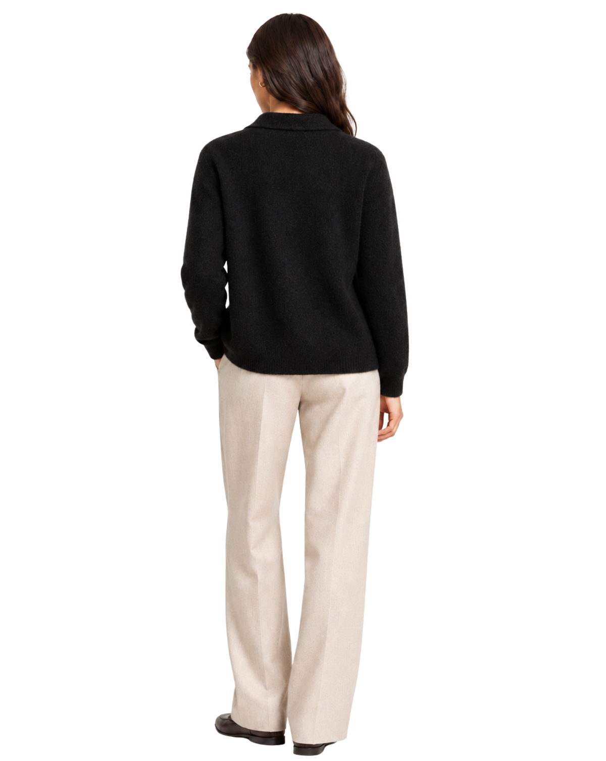 A woman shown from the back wearing a black knit long-sleeve top and light beige straight-leg trousers against a plain white background.