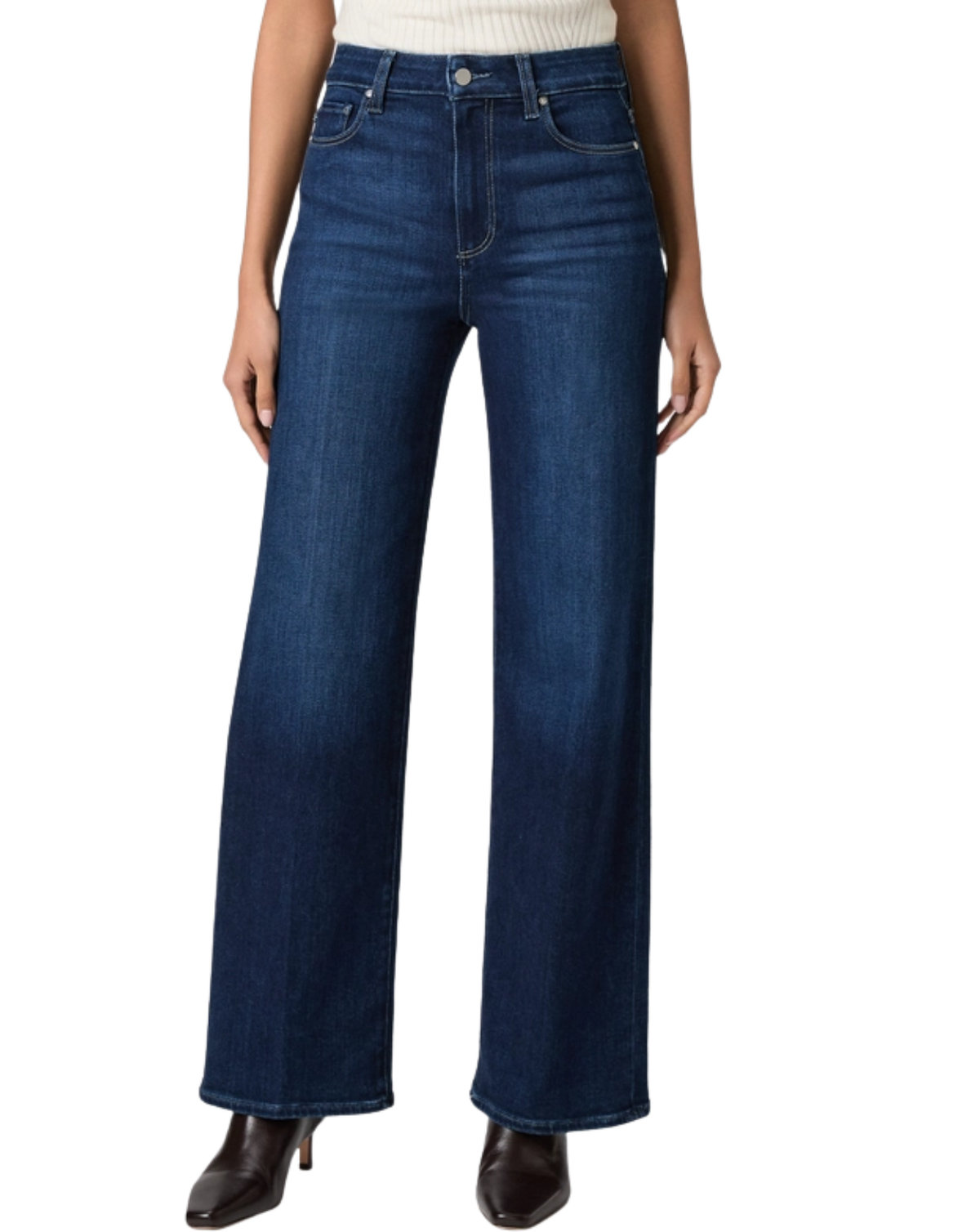 A model wearing a pair of dark blue wide-leg jeans with a cream ribbed top and dark brown pointed-toe heels, shown from the waist down on a white background.