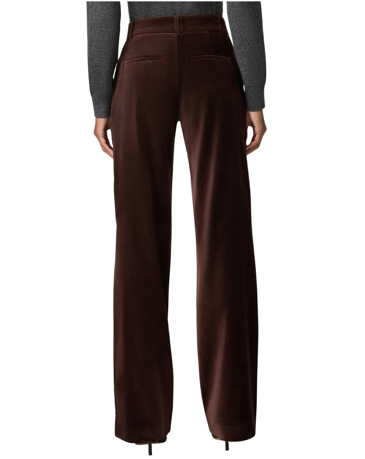 A person shown from the back wearing high-waisted, wide-leg brown trousers made of a velvet-like fabric, paired with a dark gray long-sleeve top, against a plain white background.