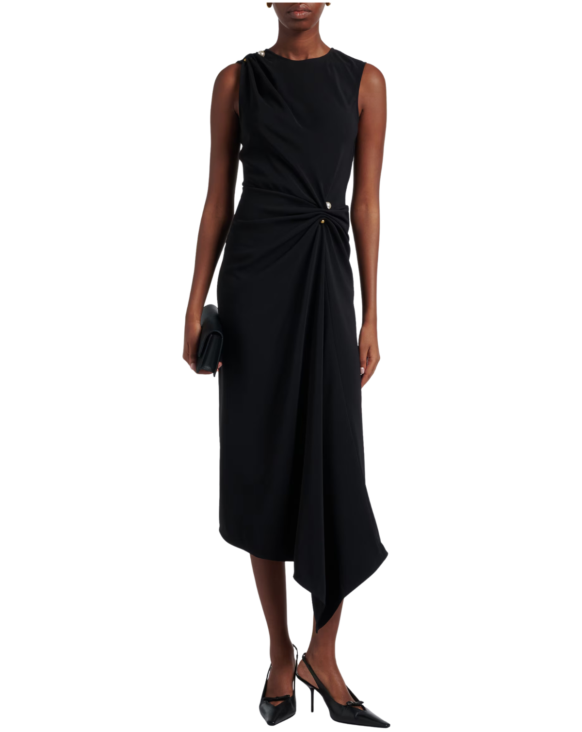 A model wearing a sleeveless black midi dress with an asymmetrical draped neckline and a twisted detail at the waist, styled with black pointed-toe heels and a matching black clutch against a plain white background.