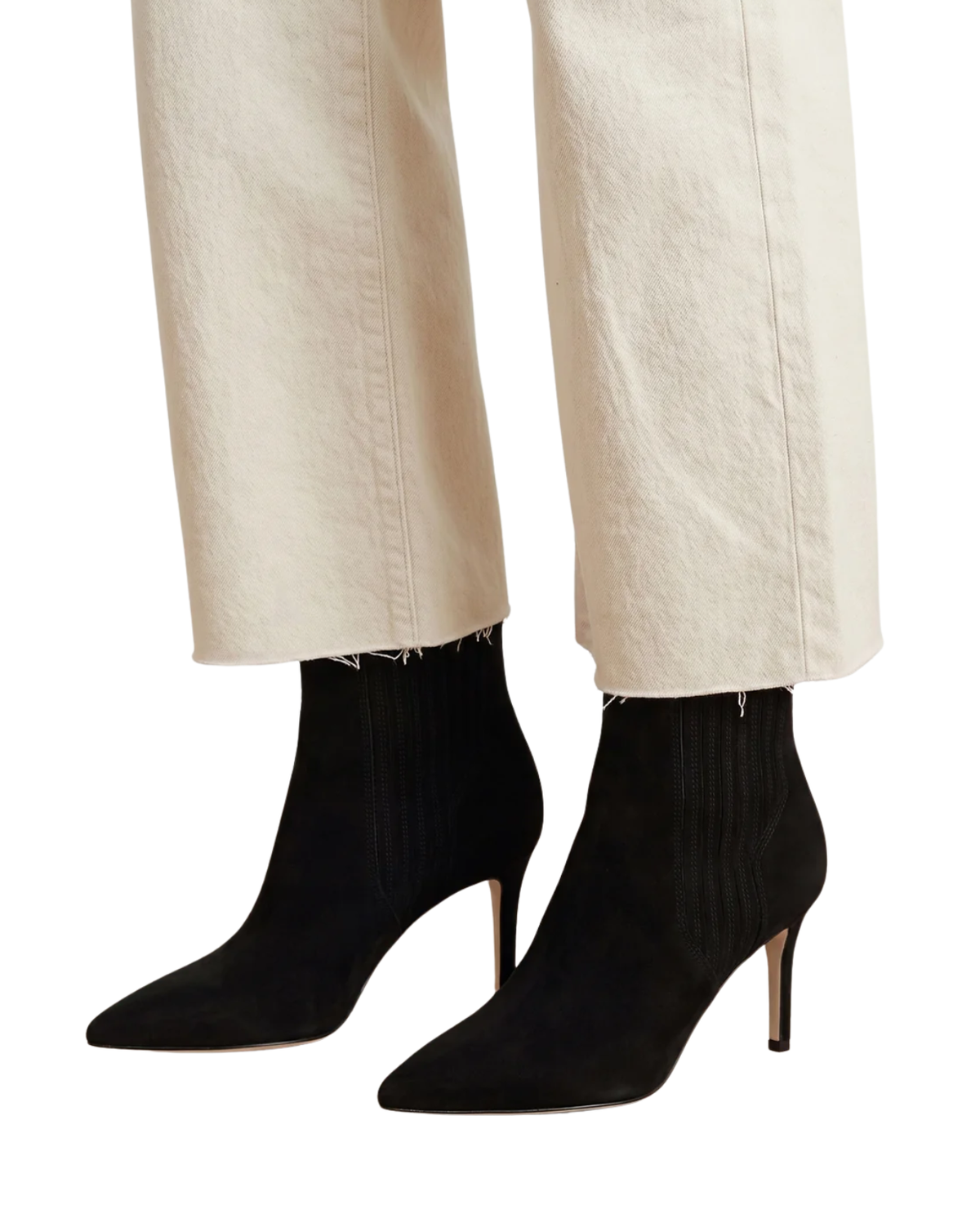 Black pointed-toe ankle boots with a ribbed texture and slim high heels, shown on a model wearing off-white trousers against a white background.