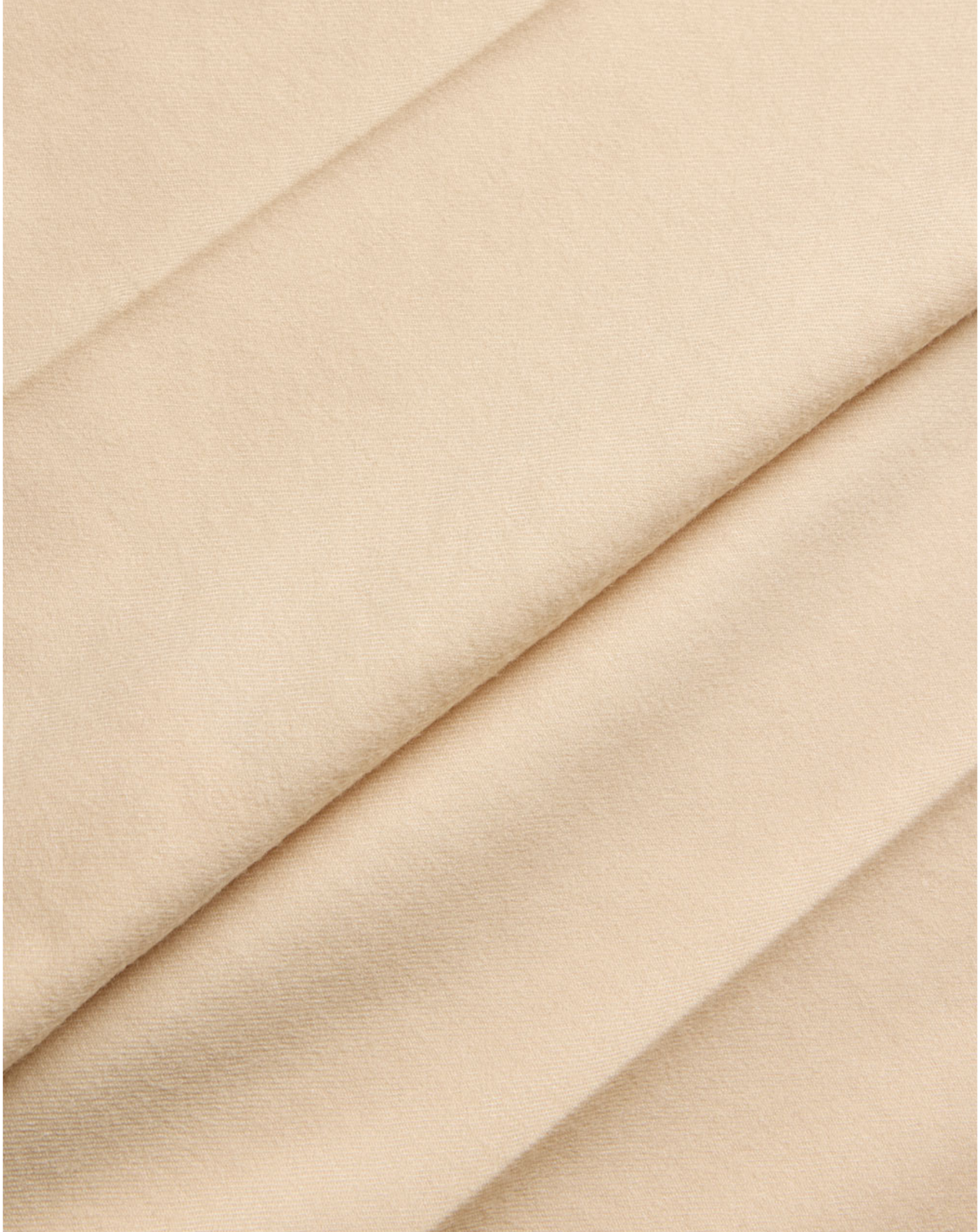 A close-up of draped beige fabric with soft folds and a smooth texture.